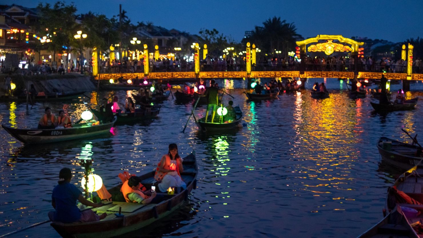 HOI AN, VIETNAM - APRIL 24: Tourists, mostly domestic, take a boat tour through the Thu Bon river on April 24, 2021 in Hoi An, Vietnam. Hoi An, a UNESCO heritage site, once a hot spot favorited by foreign tourists, has had to undergo the tribulations of survival amid Covid-19 impacts. The number of domestic visitors has begun rising thanks to the effort of key players in the tourism sector by decreasing airfares, entrance fees and adding more tourism products that fit the domestic tourist market, such as opening pedestrian zones, night markets, craft villages and traditional games. (Photo by Linh Pham/Getty Images).