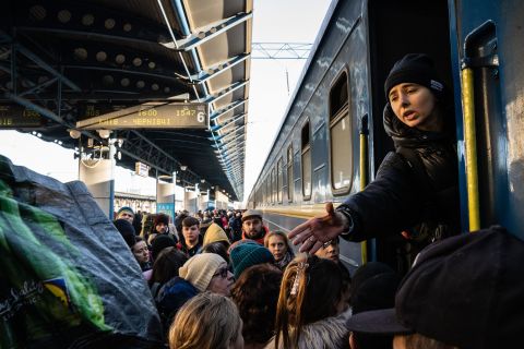 Passengers anxiously board trains in Kyiv before heading to destinations in the western part of the country on Monday, February 28.