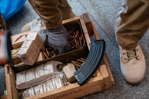 A member of the Territorial Defense Forces loads rifle magazines in Kyiv on February 28.