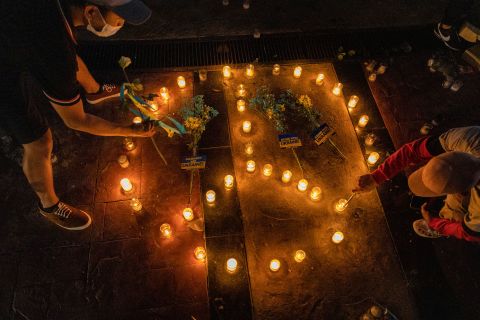 People in Quezon City, Philippines, light candles in the shape of a peace sign February 28 as they protest Russia's invasion of Ukraine.