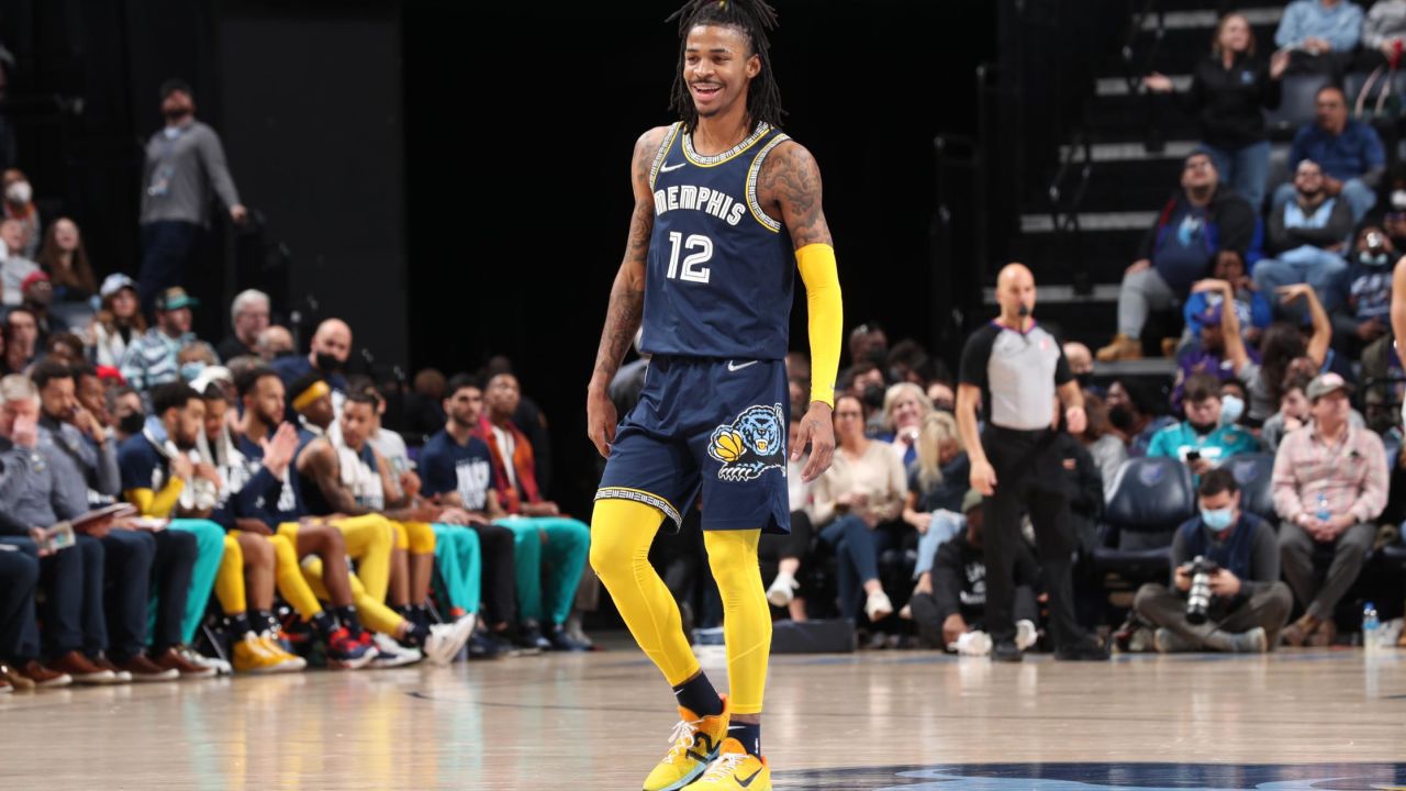 Morant looks on and smiles during the game against the Spurs.