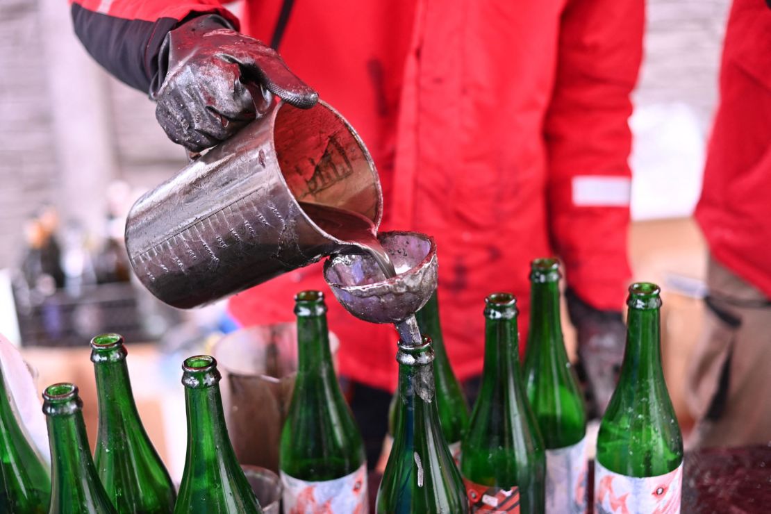 A volunteer demonstrates the preparation of Molotov cocktails in Lviv.