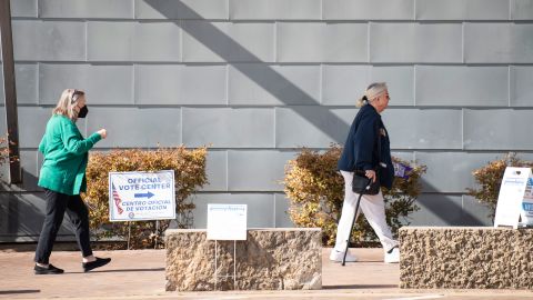 Voters walk into Lochwood Branch Library to participate in the Texas primary election in Dallas on Tuesday, March 1, 2022. 