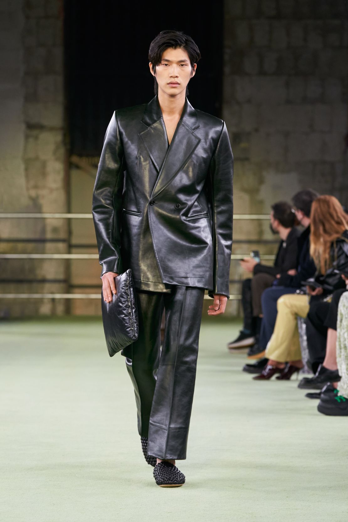 Suits made of herringbone fabric (pictured under this furry green coat) were on show at the Bottega Veneta catwalk. 