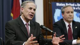 AUSTIN, TX -  FEBRUARY 18:  Governor Greg Abbott (C) speaks alongside U.S. Sen. Ted Cruz (R-TX) (L), Attorney General Ken Paxton (R) at a joint press conference February 18, 2015 in Austin, Texas.  The press conference addressed the United States District Court for the Southern District of Texas' decision on the lawsuit filed by a Texas-led coalition of 26 states challenging President Obama's executive action on immigration.  (Photo by Erich Schlegel/Getty Images)