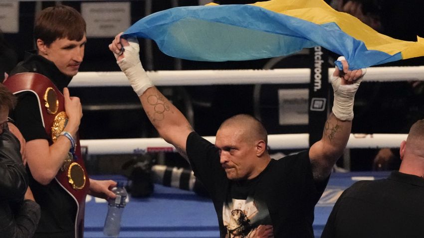 Oleksandr Usyk of Ukraine celebrates after his unanimous decision victory over Anthony Joshua of Britain in their WBA (Super), WBO and IBF boxing title bout at the Tottenham Hotspur Stadium in London, Saturday, Sept. 25, 2021. Former heavyweight champions Vitali and Wladimir Klitschko are leading some of the resistance from the mayor's office in beleaguered Kyiv. Two-time Olympic champion Vasiliy Lomachenko has an assault rifle and a place in a defense force, and current heavyweight champion Aleksandr Usyk rushed back home to take up arms against the Russians. Ukraine's rich boxing community is determined to fight, this time with guns instead of their fists. (AP Photo/Frank Augstein, File)