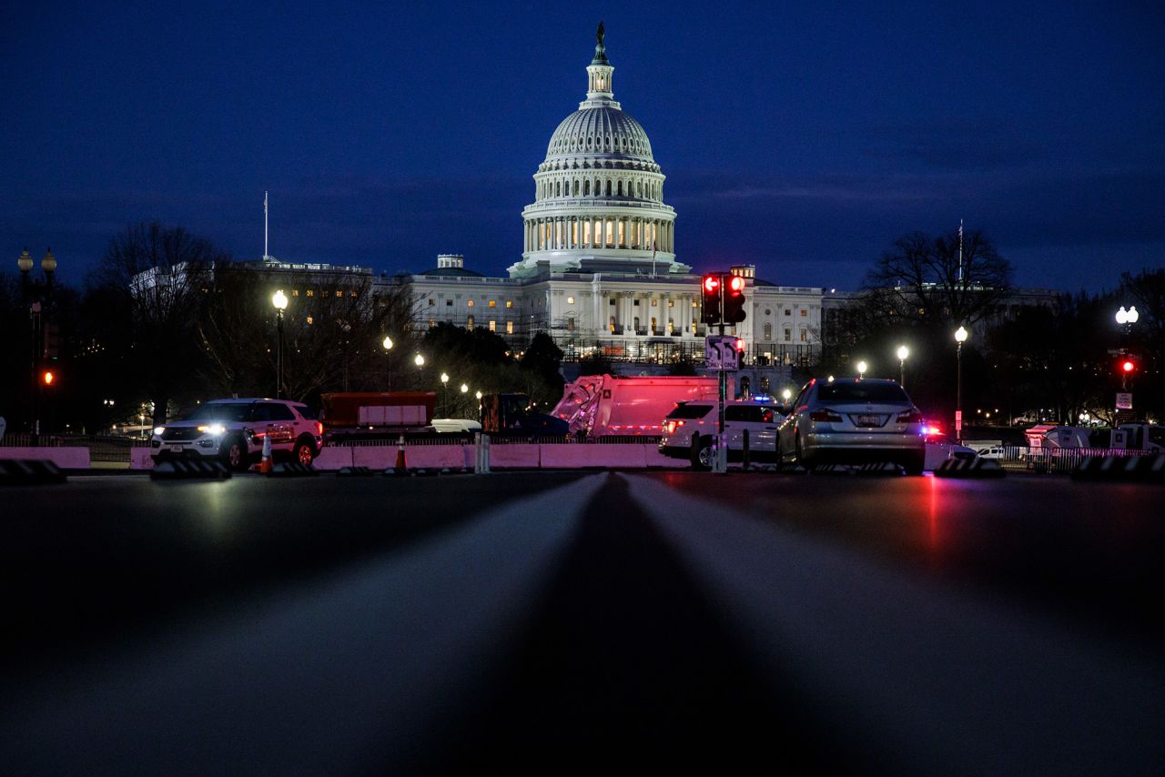 The streets surrounding the Capitol are closed off by law enforcement.