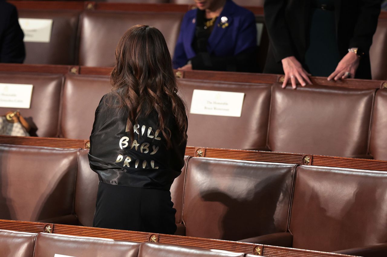 Rep. Lauren Boebert, a Republican from Colorado, wears an outfit reading "drill baby drill" as she arrives in the chamber.