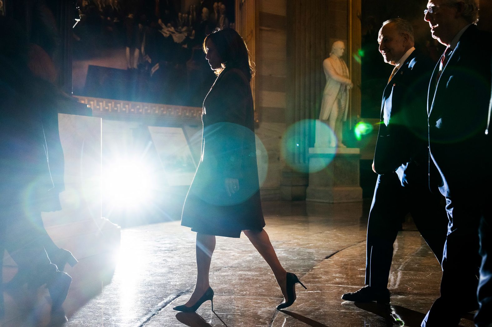 Harris walks to the House chamber followed by Senate Majority Leader Chuck Schumer and Senate Minority Leader Mitch McConnell.