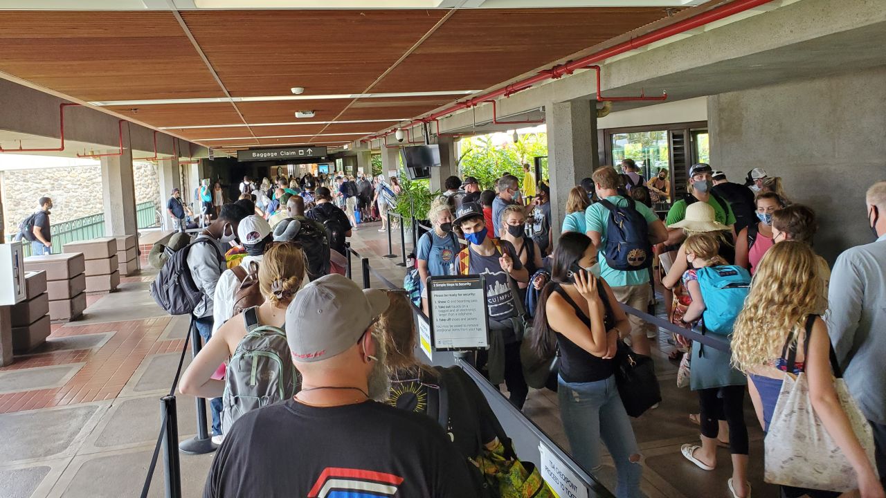 Long security lines are visible at Kahului Airport as passengers wait for departing flights from the island of Maui on August 5, 2021.