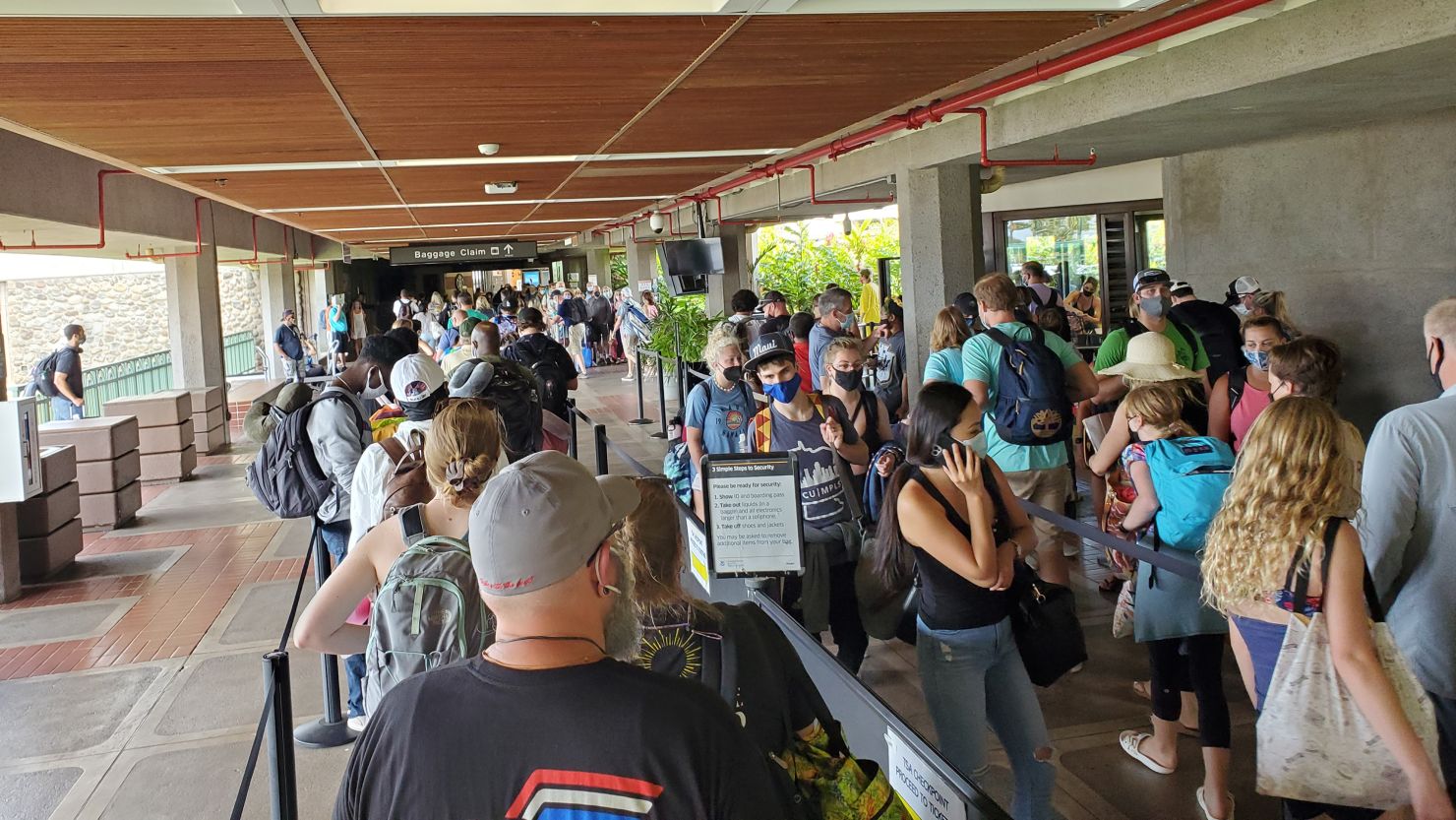 Long security lines are visible at Kahului Airport as passengers wait for departing flights from the island of Maui on August 5, 2021.