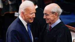 President Joe Biden greets Supreme Court Associate Justice Stephen Breyer as he arrives to deliver his first State of the Union address to a joint session of Congress, at the Capitol in Washington, Tuesday, March 1, 2022. (AP Photo/J. Scott Applewhite, Pool)