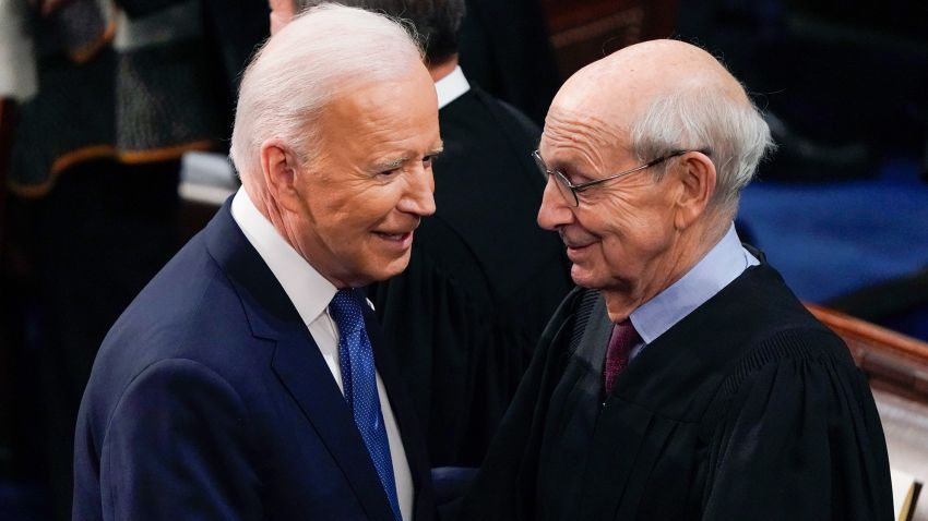 President Joe Biden greets Supreme Court Associate Justice Stephen Breyer as he arrives to deliver his first State of the Union address to a joint session of Congress, at the Capitol in Washington, Tuesday, March 1, 2022. (AP Photo/J. Scott Applewhite, Pool)
