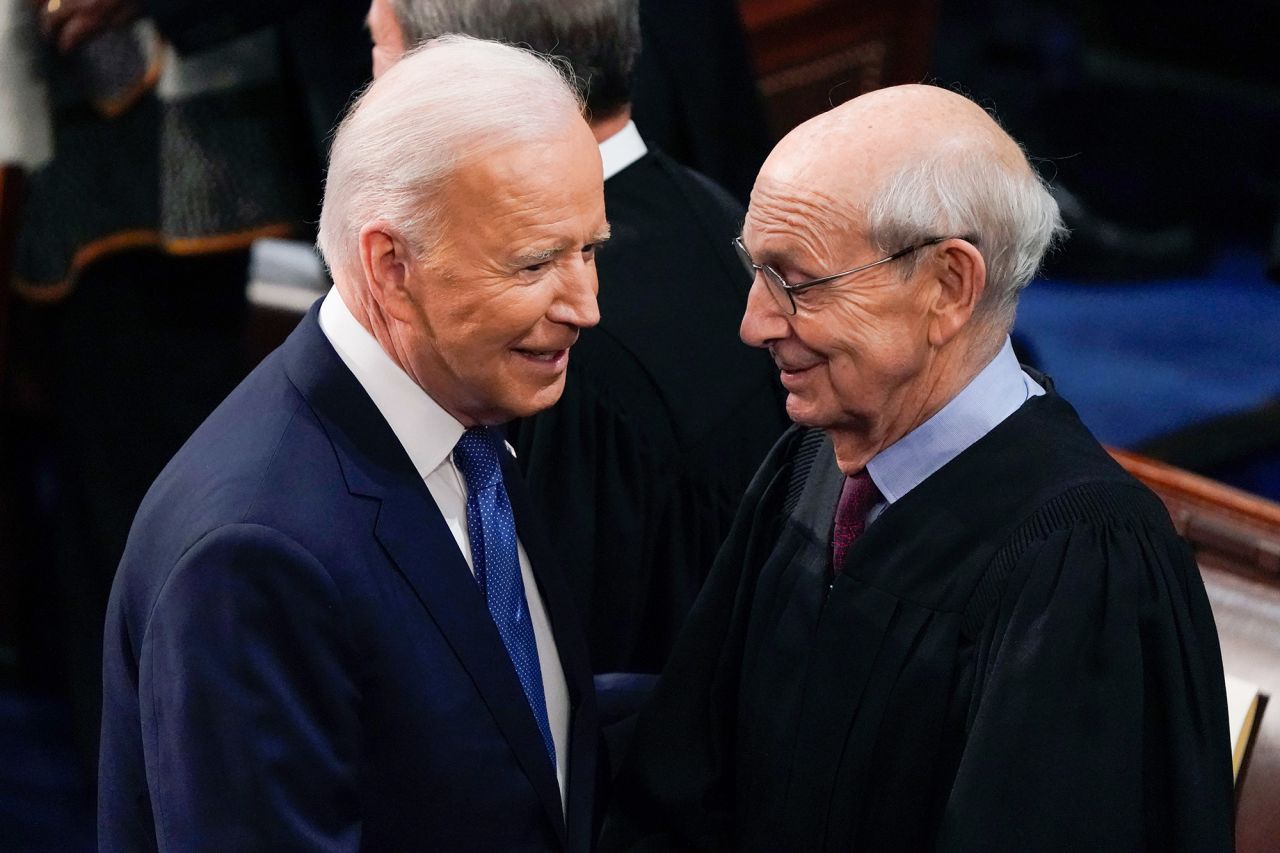 Biden greets Justice Breyer.
