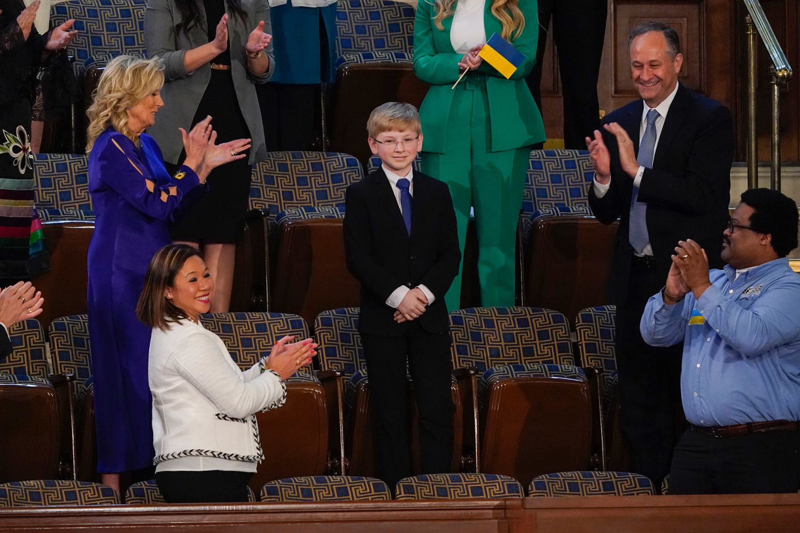 Joshua Davis, a seventh-grader from Midlothian, Virginia, stands as President Biden acknowledges him during his speech. Davis is a student-advocate for diabetes awareness.