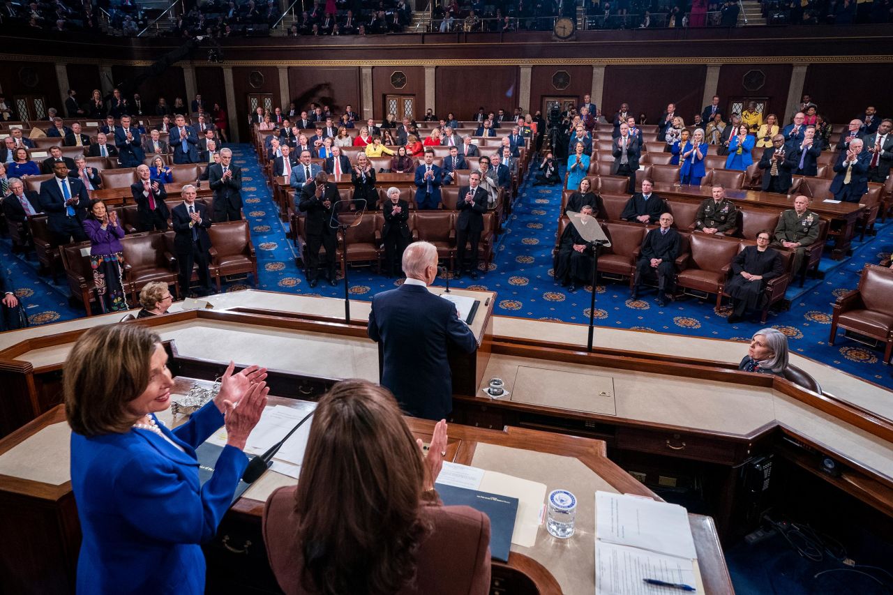 Pelosi and Harris applaud during Biden's speech. It's <a href="https://www.cnn.com/politics/live-news/biden-state-of-the-union-2022/h_1e0eb033be0da9ec202ddd791b3db8ee" target="_blank">the first time</a> two women have been behind the President during an official State of the Union.
