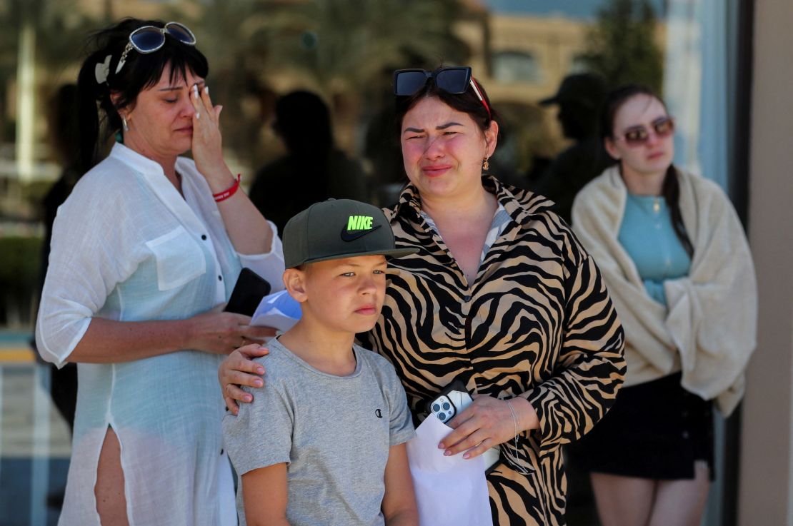Some 100 Ukrainian tourists were stuck at the Egyptian Red Sea resorts of Hurghada, watching Russia's assault on their country from afar. They were pictured holding up signs on February 27 denouncing Russia's invasion. 