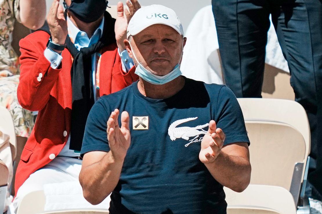 Marian Vajda applauding as Djokovic plays Stefanos Tsitsipas of Greece during the 2021 French Open.