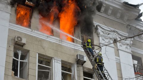 Firefighters work to contain a fire in the complex of buildings housing the Kharkiv regional SBU security service and the regional police, allegedly hit during recent shelling by Russia, in Kharkiv on March 2, 2022. 