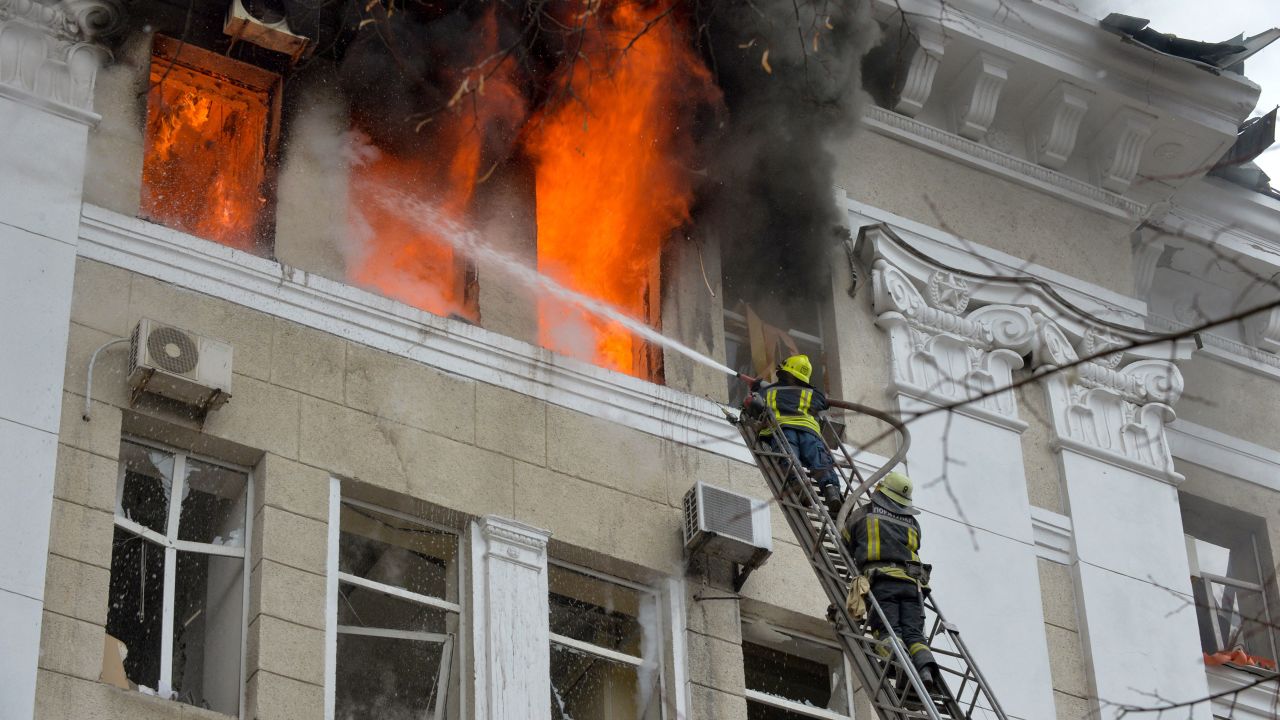 Firefighters work to contain a fire in the complex of buildings housing the Kharkiv regional SBU security service and the regional police, allegedly hit during recent shelling by Russia, in Kharkiv on March 2, 2022.