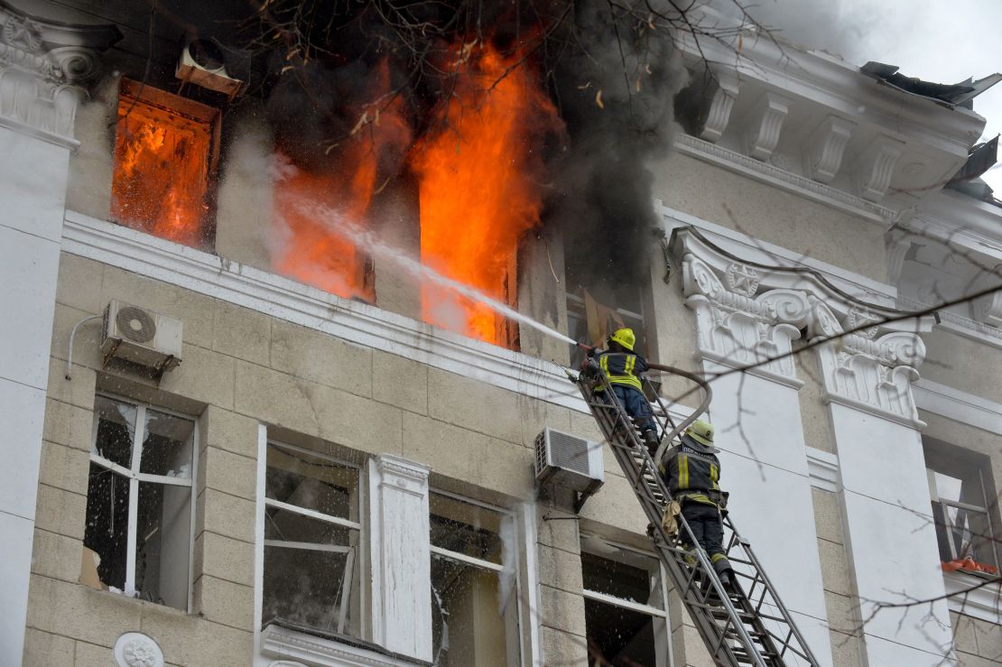 Firefighters work to contain a fire in the complex of buildings housing the Kharkiv regional SBU security service and the regional police, allegedly hit during recent shelling by Russia, in Kharkiv on March 2, 2022. 