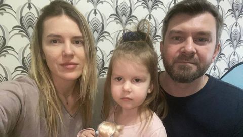 Yana, Liza and Sergii Lysenko in their apartment on Thursday morning. They initially intended to stay home.