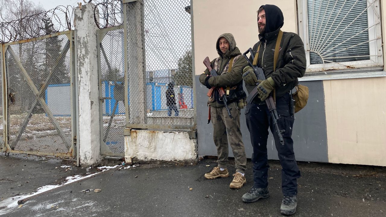 Roman (L) and Rostislav man the guard post outside the TV tower on March 2.