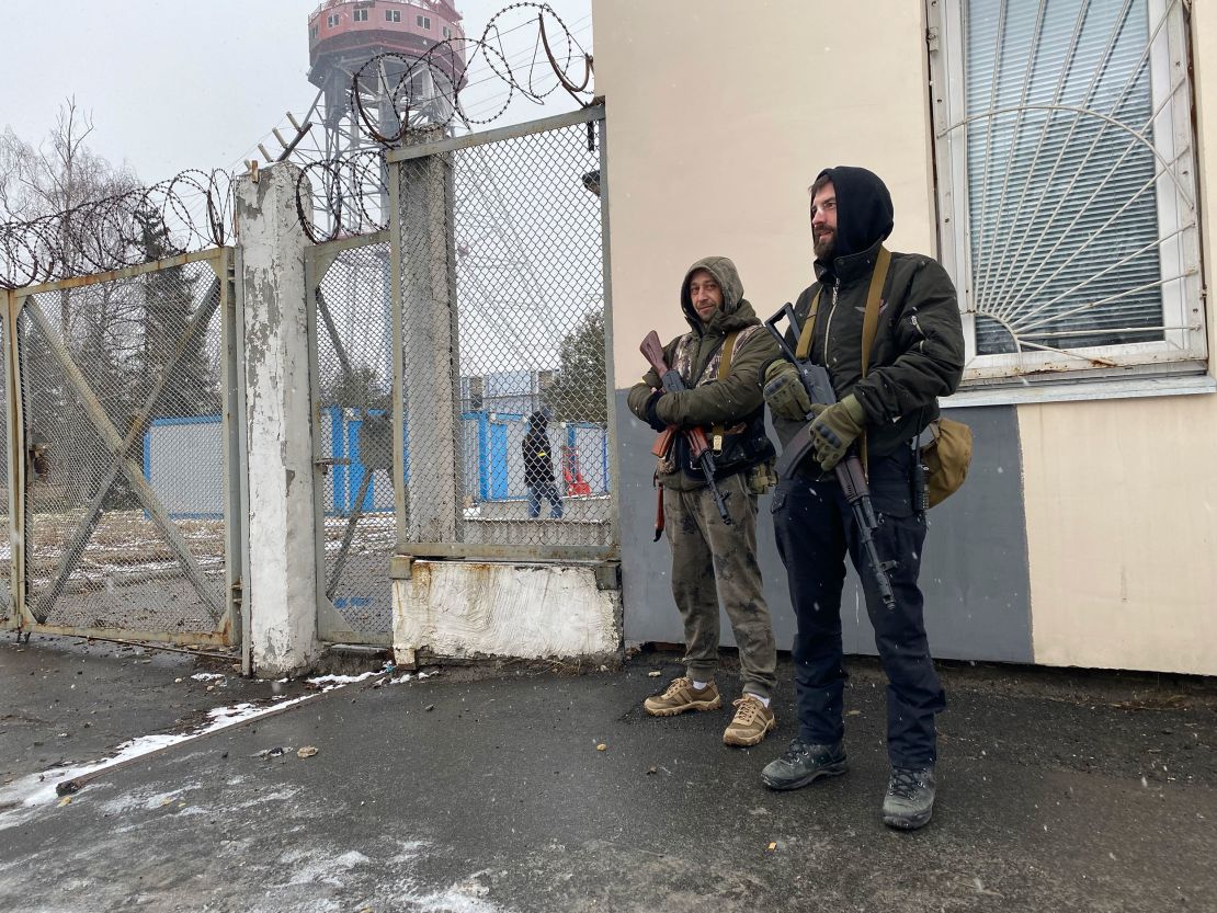 Roman (L) and Rostislav man the guard post outside the TV tower on March 2.