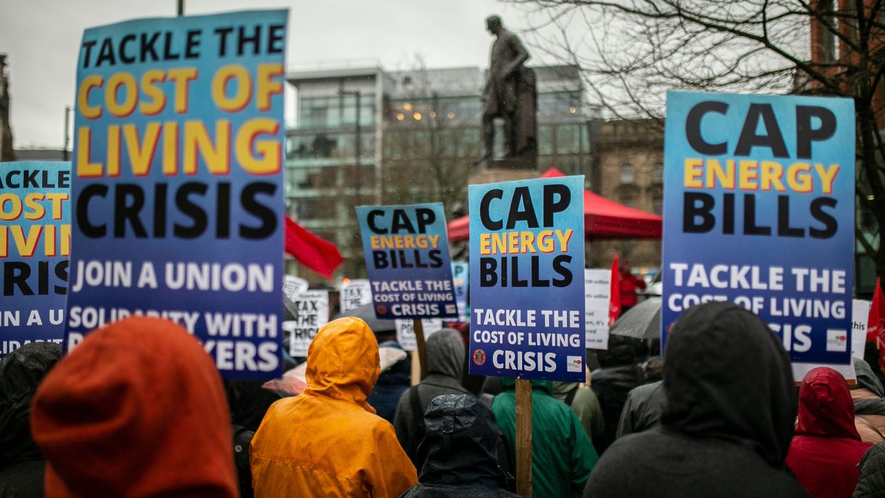 People march through  Manchester on February 12, as protests were held nationally against rising energy bills and the cost of living.