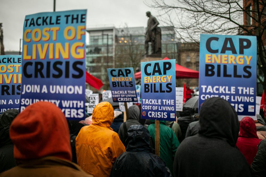 People march through  Manchester on February 12, as protests were held nationally against rising energy bills and the cost of living.