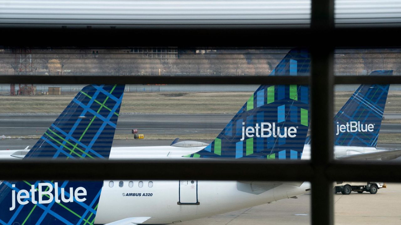 File photo: JetBlue planes sit at Ronald Reagan Washington National Airport in Arlington, Virginia, on January 18, 2022.  
