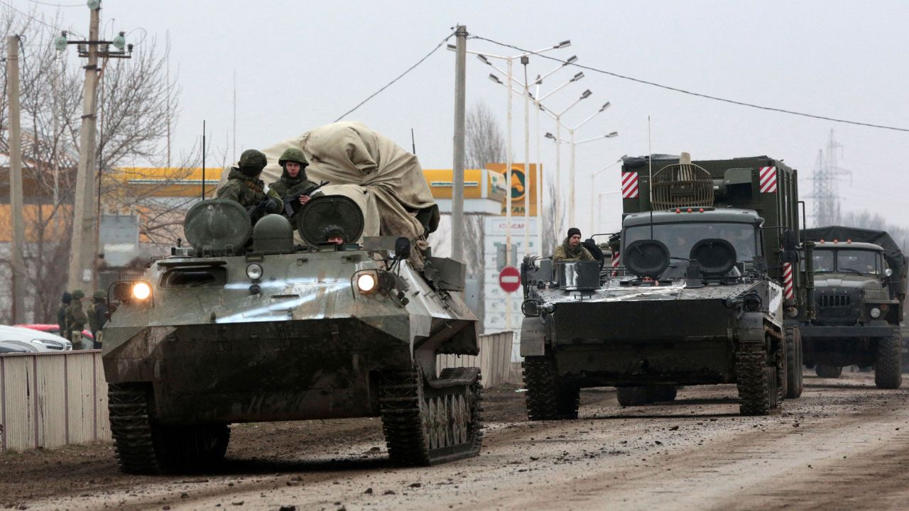 Russian army military vehicles are seen in Armyansk, Crimea, on February 25, 2022. - Ukrainian forces fought off Russian invaders in the streets of the capital Kyiv on February 25, 2022, as President Volodymyr Zelensky accused Moscow of targeting civilians and called for more international sanctions. Pre-dawn blasts in Kyiv set off a second day of violence after Russian President Vladimir Putin defied Western warnings to unleash a full-scale invasion on on February 24, 2022, that quickly claimed dozens of lives and displaced at least 100,000 people. (Photo by STRINGER / AFP) (Photo by STRINGER/AFP via Getty Images)