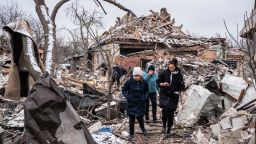 Women walk among remains of residential buildings destroyed by shelling, as Russia's invasion of Ukraine continues, in Zhytomyr, Ukraine March 2, 2022. REUTERS/Viacheslav Ratynskyi