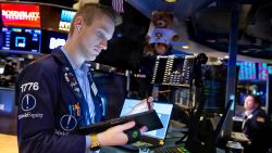 In this photo provided by the New York Stock Exchange, trader Colby Nelson works on the floor, Monday, Feb 28, 2022. Markets quivered Monday amid worries about how high oil prices will go and how badly the global economy will get hit after the U.S. and allies upped the financial pressure on Russia for its invasion of Ukraine. 