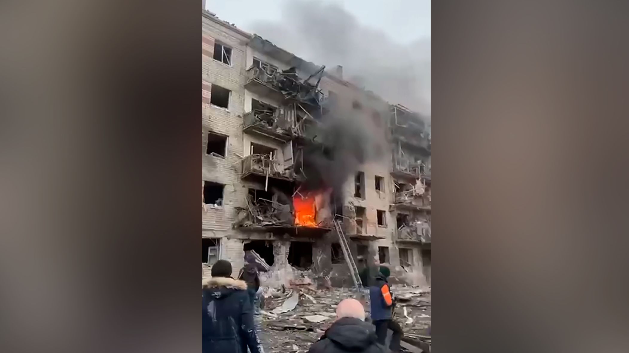 First responders fight a fire at an apartment complex hit by Russian military strikes in Kharkiv on Tuesday.