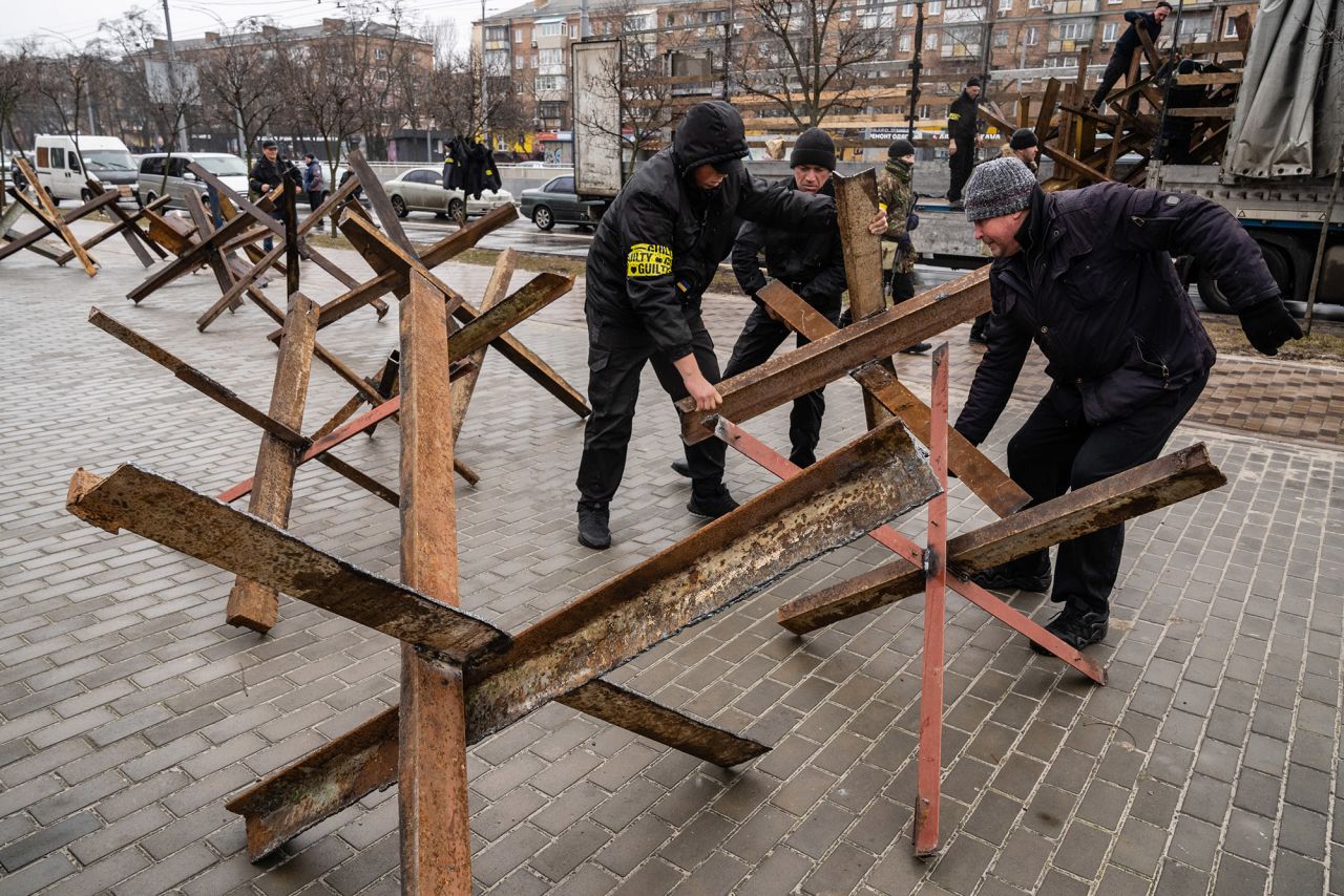 Militia members set up anti-tank barricades in Kyiv on March 2.