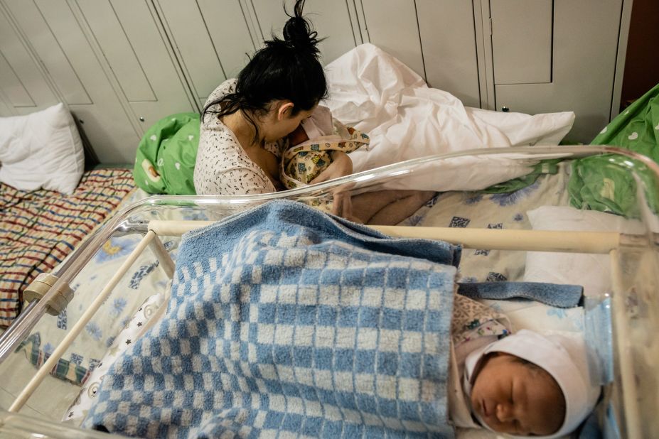 A mother cares for her two infant sons in the underground shelter of a maternity hospital in Kyiv on March 3. She gave birth a day earlier, and she and her husband haven't yet decided on names for the twins.