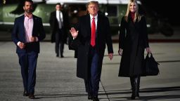 US President Donald Trump (C), daughter Senior Advisor Ivanka Trump and son Donald Trump Jr. (L) make their way to board Air Force One before departing from Dobbins Air Reserve Base in Marietta, Georgia on January 4, 2021. - President Donald Trump, still seeking ways to reverse his election defeat, and President-elect Joe Biden converge on Georgia on Monday for dueling rallies on the eve of runoff votes that will decide control of the US Senate. Trump, a day after the release of a bombshell recording in which he pressures Georgia officials to overturn his November 3 election loss in the southern state, is to hold a rally in the northwest city of Dalton in support of Republican incumbent senators Kelly Loeffler and David Perdue. 