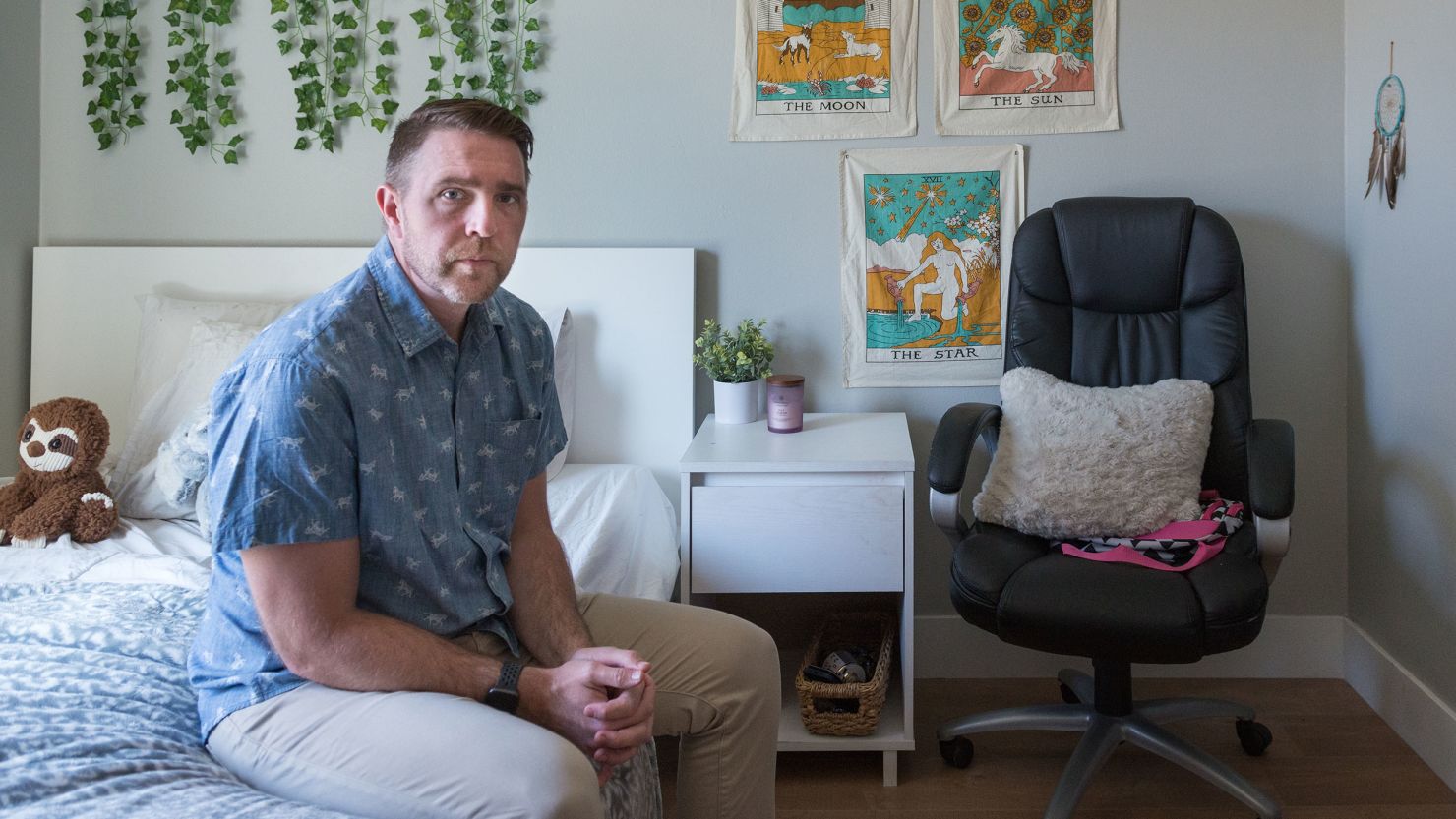 Lee Stonum sits on the bed of his daughter, Kennedy. He has left her bedroom untouched since the 17-year-old's death in February.