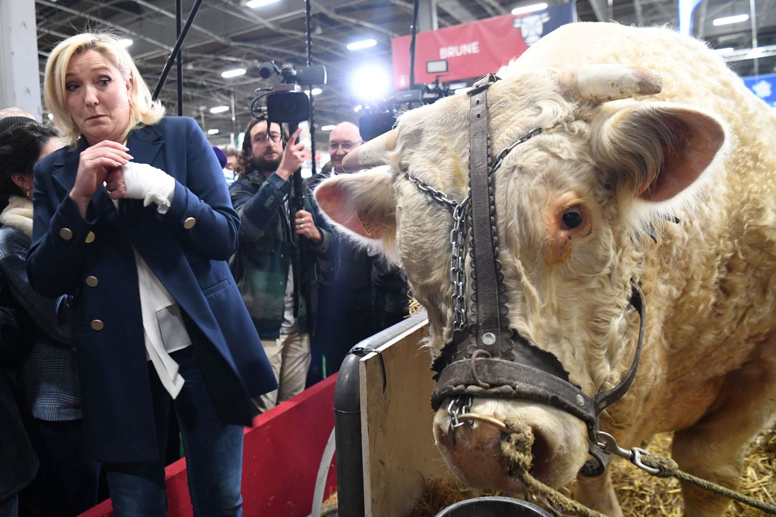 French presidential candidate Marine Le Pen reacts after she tried to kiss a cow at the Paris International Agriculture Fair on Wednesday, March 2.
