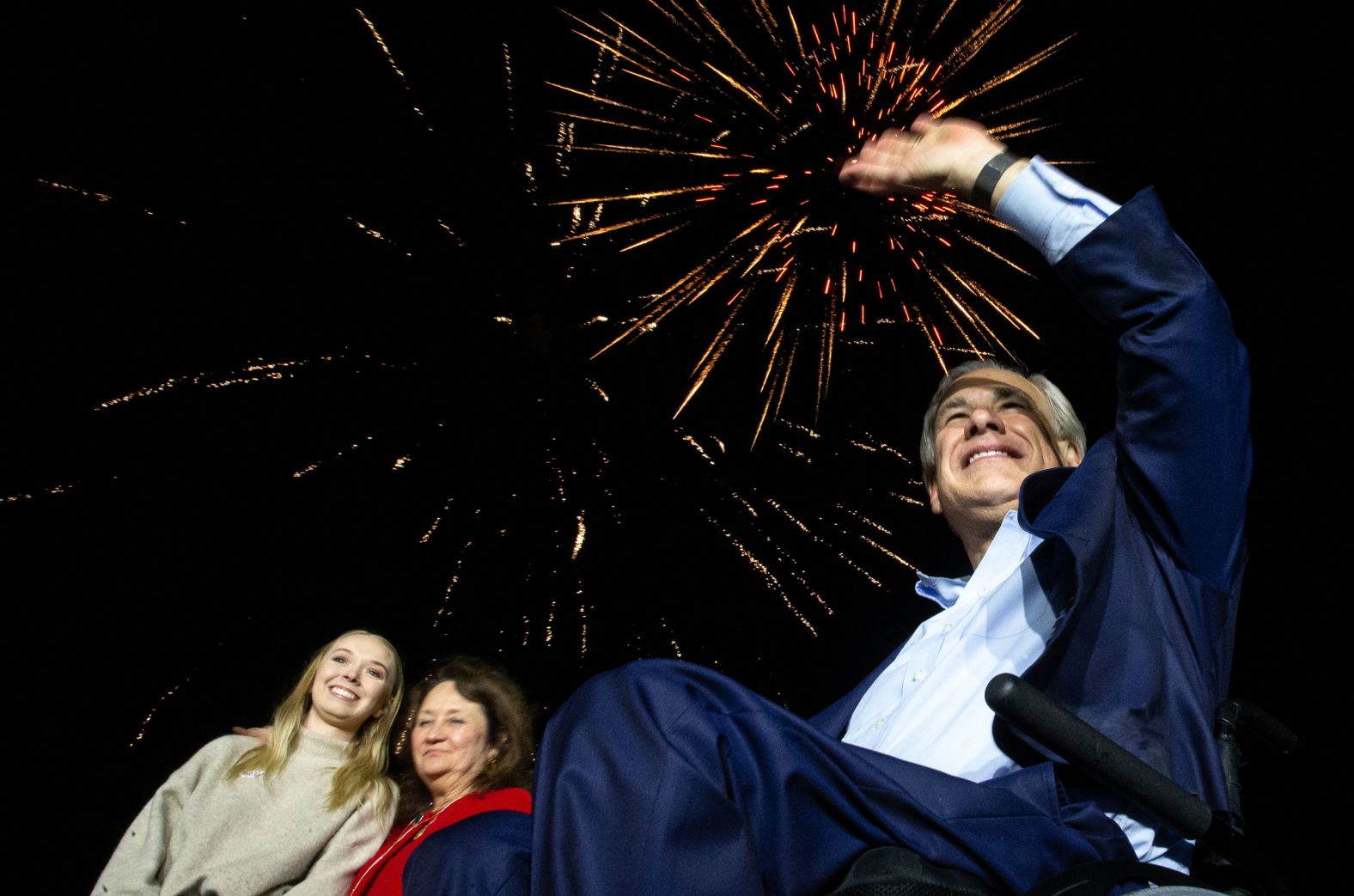 Fireworks explode behind Texas Gov. Greg Abbott; his wife, Cecilia; and his daughter, Audrey, after he gave a victory speech in Corpus Christi, Texas, on Tuesday, March 1. <a href="index.php?page=&url=https%3A%2F%2Fwww.cnn.com%2F2022%2F03%2F02%2Fpolitics%2Ftexas-2022-primary-election-takeaways%2Findex.html" target="_blank">Abbott won the state's Republican primary</a> and will face Democrat Beto O'Rourke in November's election.