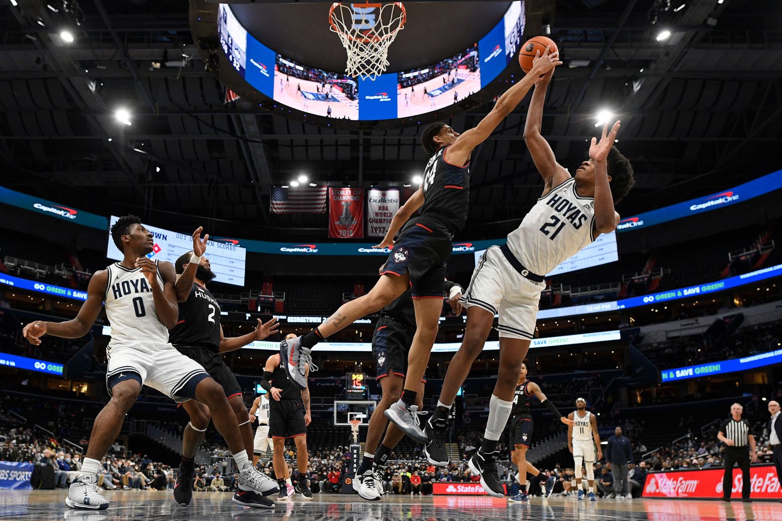 Connecticut's Andre Jackson blocks a shot from Georgetown's Ryan Mutombo during a college basketball game on Sunday, February 27.