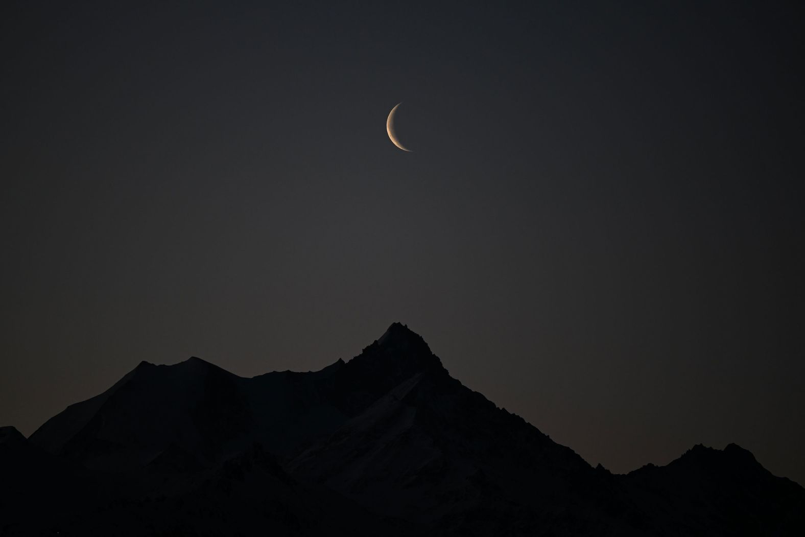 A crescent moon is seen above the Weisshorn mountain in the Swiss Alps early on Sunday, February 27. <a href="index.php?page=&url=http%3A%2F%2Fwww.cnn.com%2F2022%2F02%2F24%2Fworld%2Fgallery%2Fphotos-this-week-february-17-february-24%2Findex.html" target="_blank">See last week in 35 photos.</a>