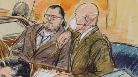 This artist sketch depicts Guy Reffitt, left, joined by his lawyer William Welch, in federal court in Washington on Monday, Feb. 28, 2022.