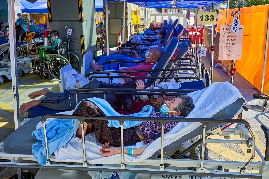 Covid-19 patients seen laying on beds outside the Caritas Medical Center in Hong Kong. 