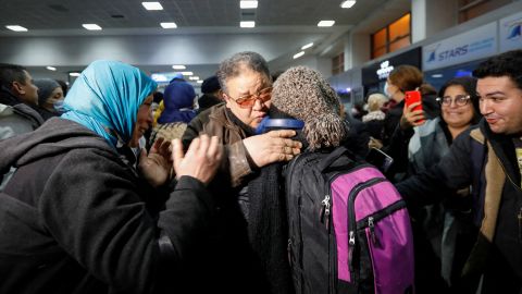Tunisians who fled to Romania following Russia's invasion of Ukraine were photographed on March 2 hugging their relatives in tears as they arrived at the airport in the Tunisian capital of Tunis. 