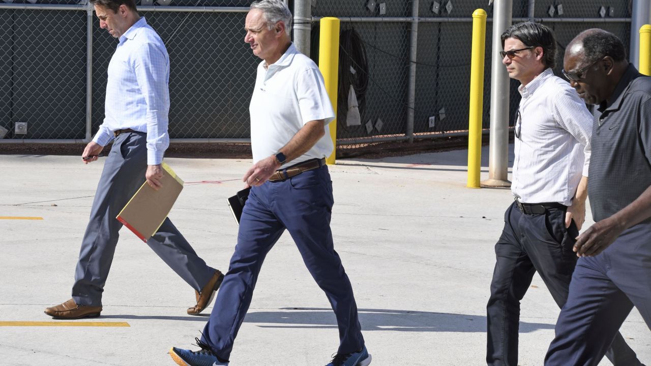 MLB commissioner Rob Manfred (second left) attends negotiations with the MLB Players' Association at the start of this week.