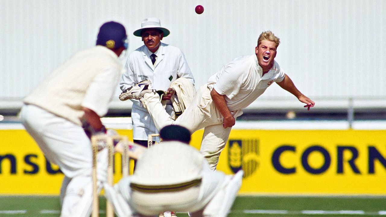 Warne bowling during the Third Ashes test match against England at Old Trafford cricket ground on July 4, 1997.