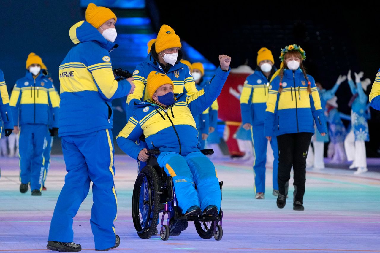 Athletes from Ukraine arrive at the opening ceremony.