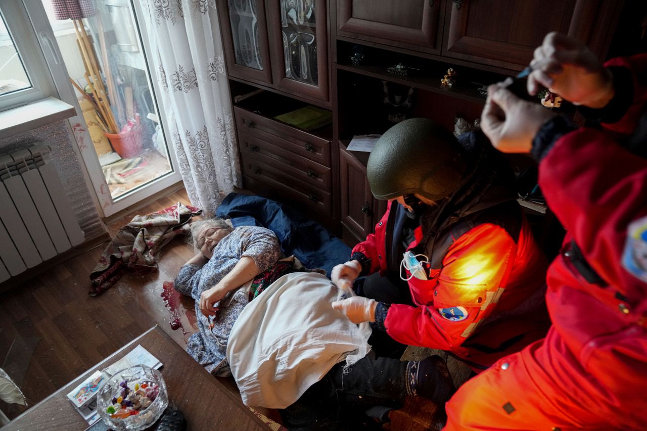 Paramedics treat an elderly woman wounded by shelling before transferring her to a hospital in Mariupol on March 2.  Zelensky says Russia waging war so Putin can stay in power &#8216;until the end of his life&#8217; w 1280